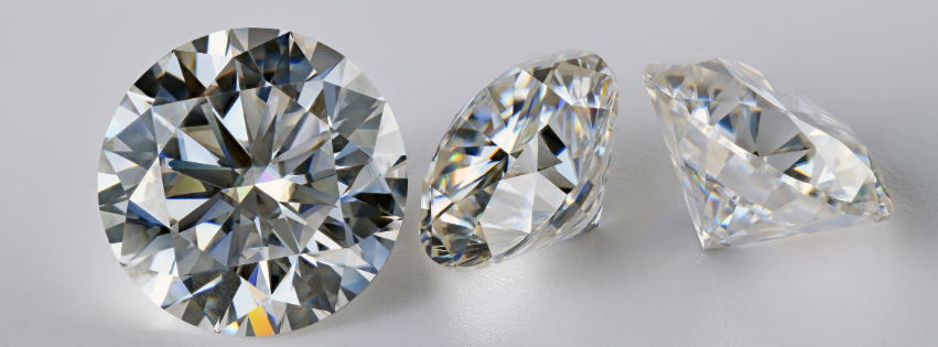 Side by side comparison of a natural mined diamond and a lab grown diamond engagement ring.