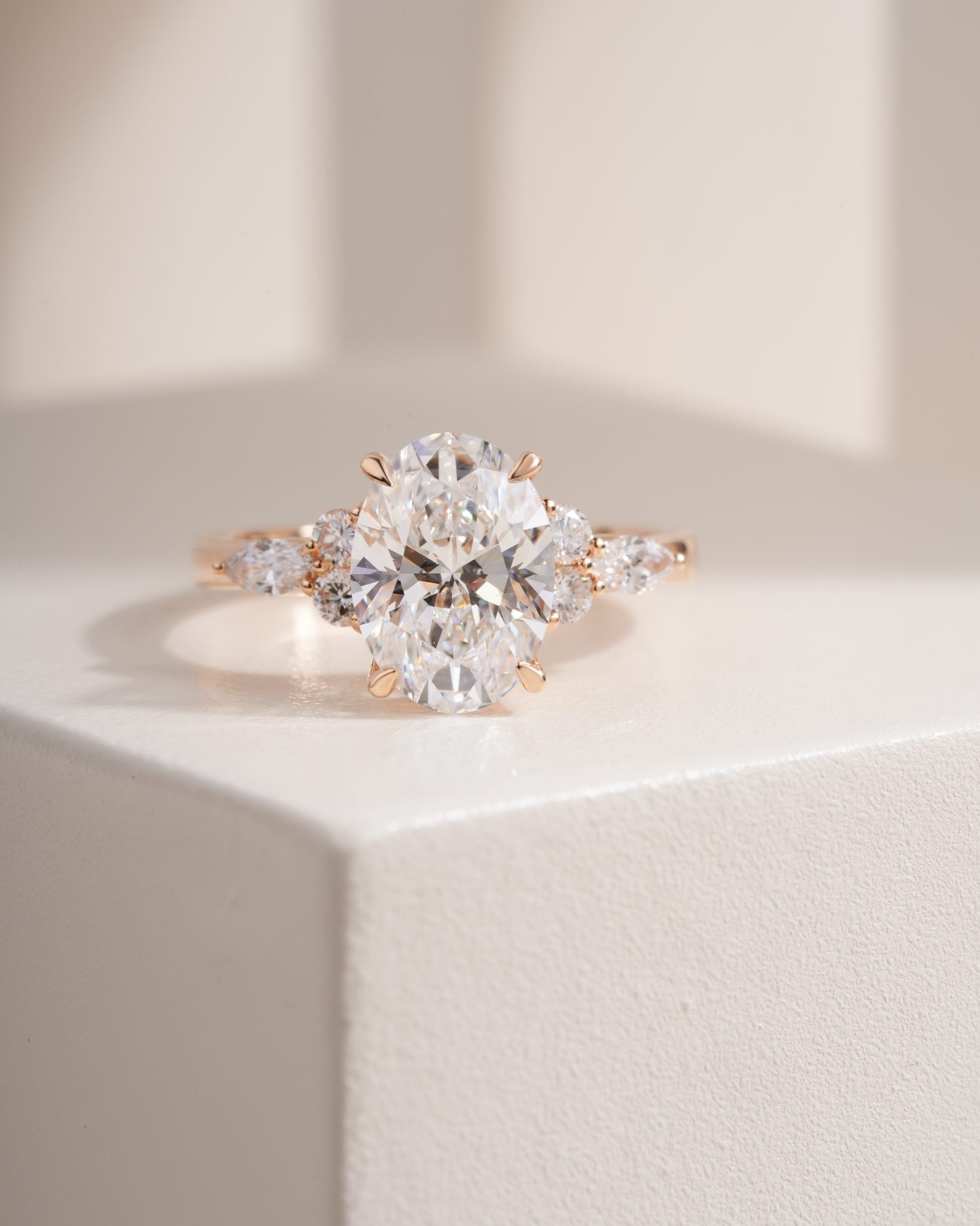 Nyra with Pear Accents and Round Shoulder Stones Ring