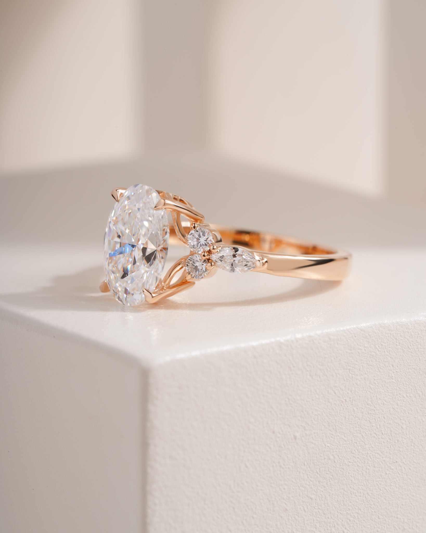Nyra with Pear Accents and Round Shoulder Stones Ring