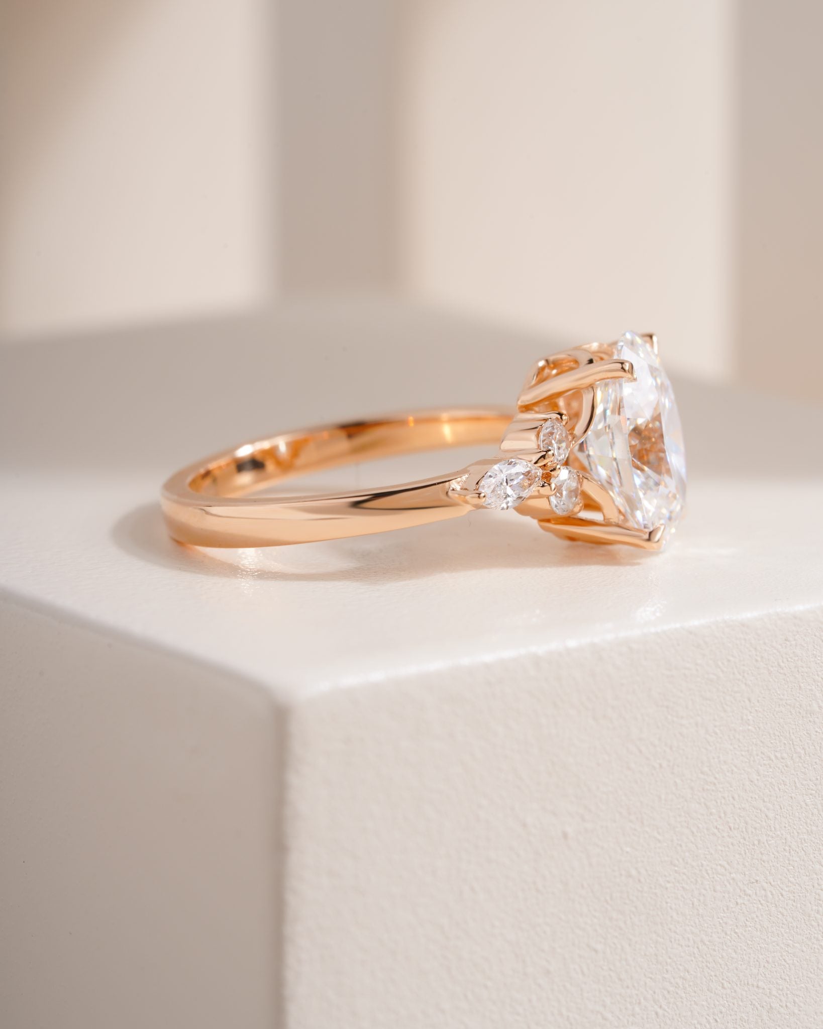 Nyra with Pear Accents and Round Shoulder Stones Ring