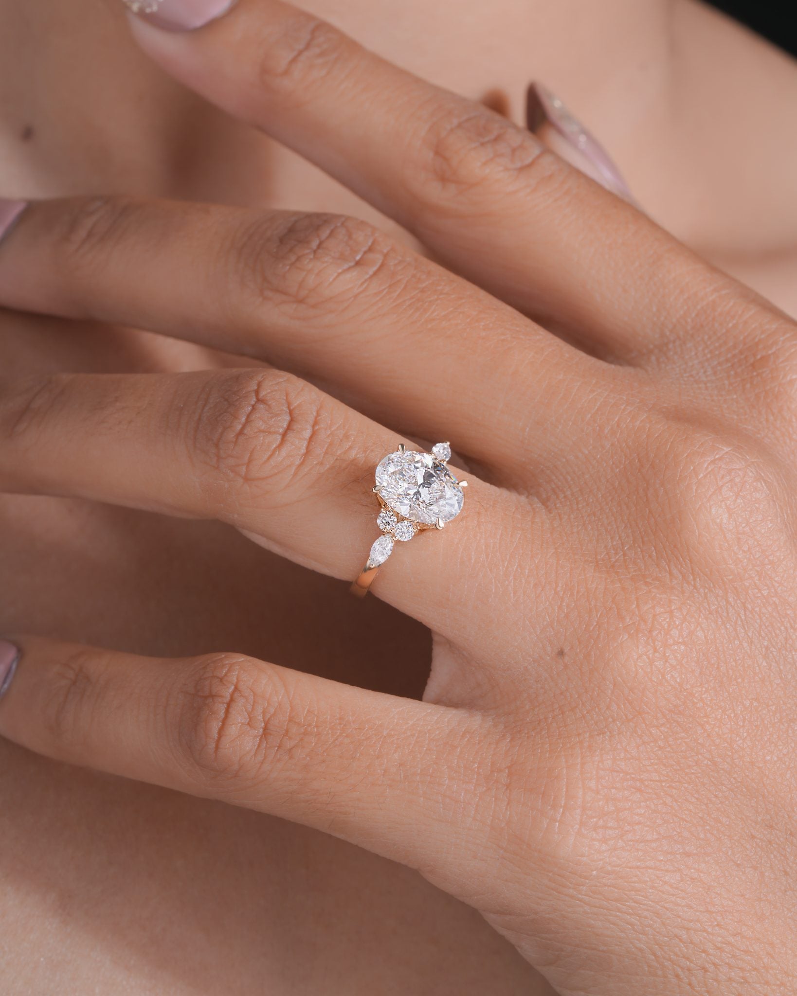 Nyra with Pear Accents and Round Shoulder Stones Ring